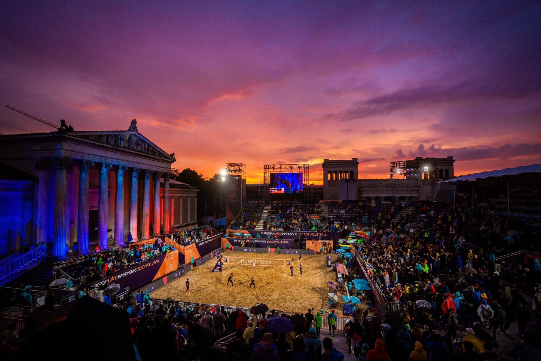 Beach volleyball stadium on Königsplatz at sunset, the stands packed
